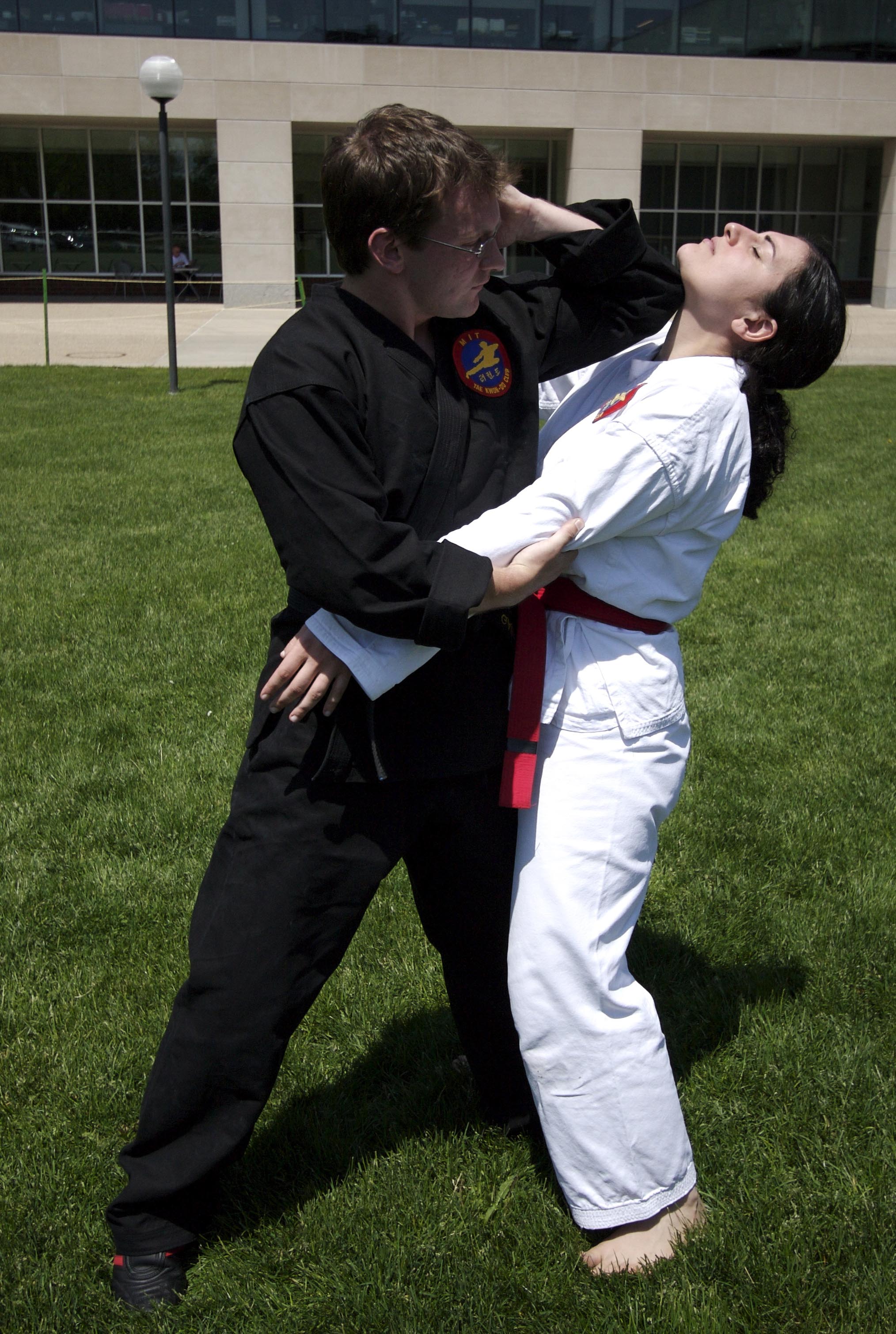 photo: Black Belt teaching Red Belt