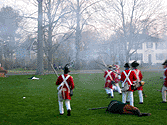 The backs of the redcoats chasing the fleeing colonials.