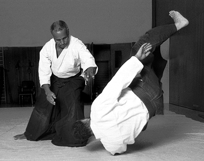 Picture of Dick Stroud throwing Bob Toabe in MIT Dojo