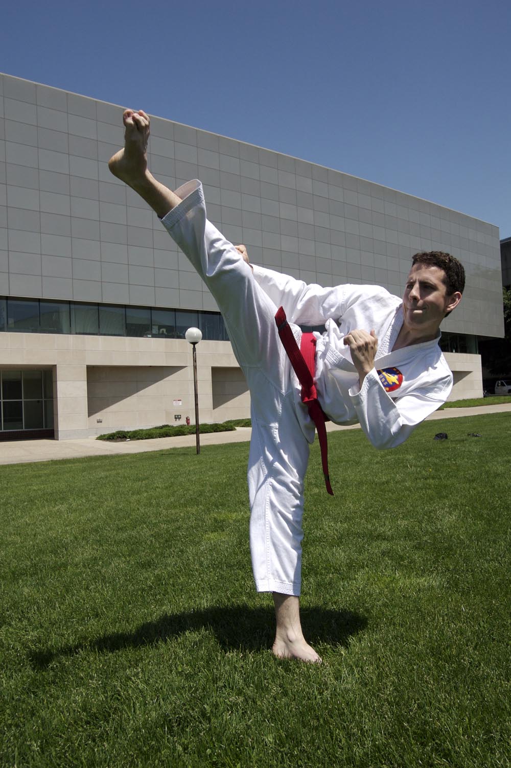 red belt doing side kick