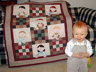 A picture of Trent and
the quilt.